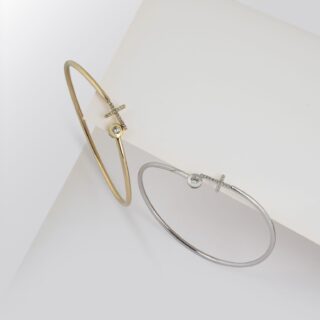 Gold and silver bangles on white background