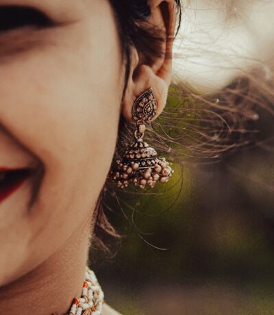 Woman wearing traditional gold earrings