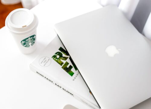 Minimalist workspace with laptop and coffee cup